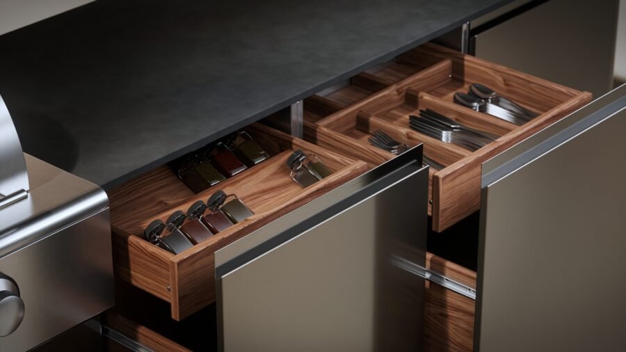 Stainless steel drawer dividers with powder coat finish, customizable to organize utensils and tools within outdoor kitchen drawers.